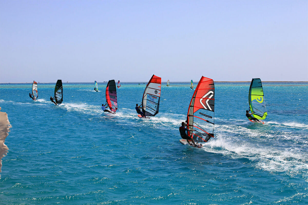 Group windsurfing at the sea