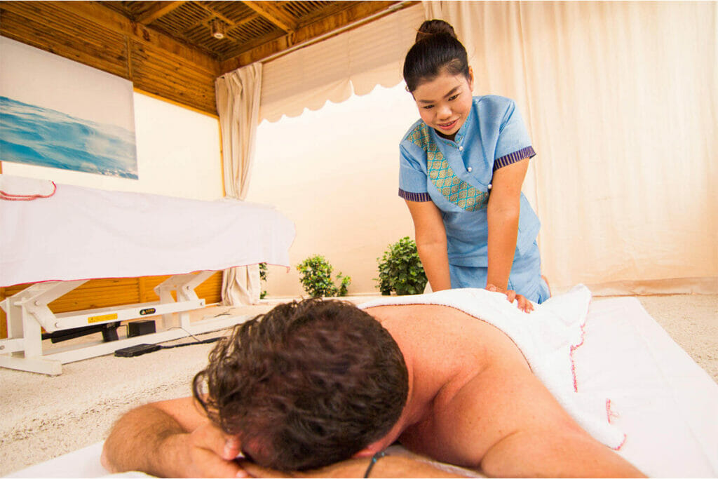 Woman massaging a man