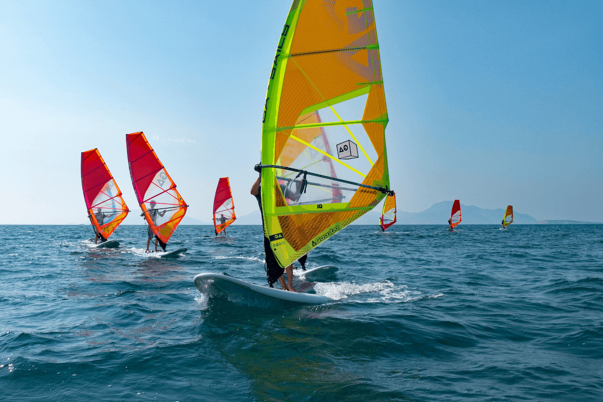 Windsurfing group by the sea in Greece