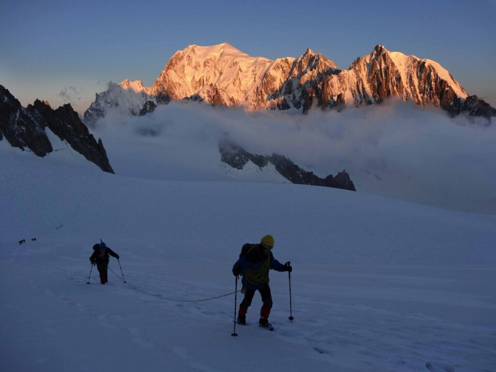 Group of climbers on Mont Blanc summit panorama